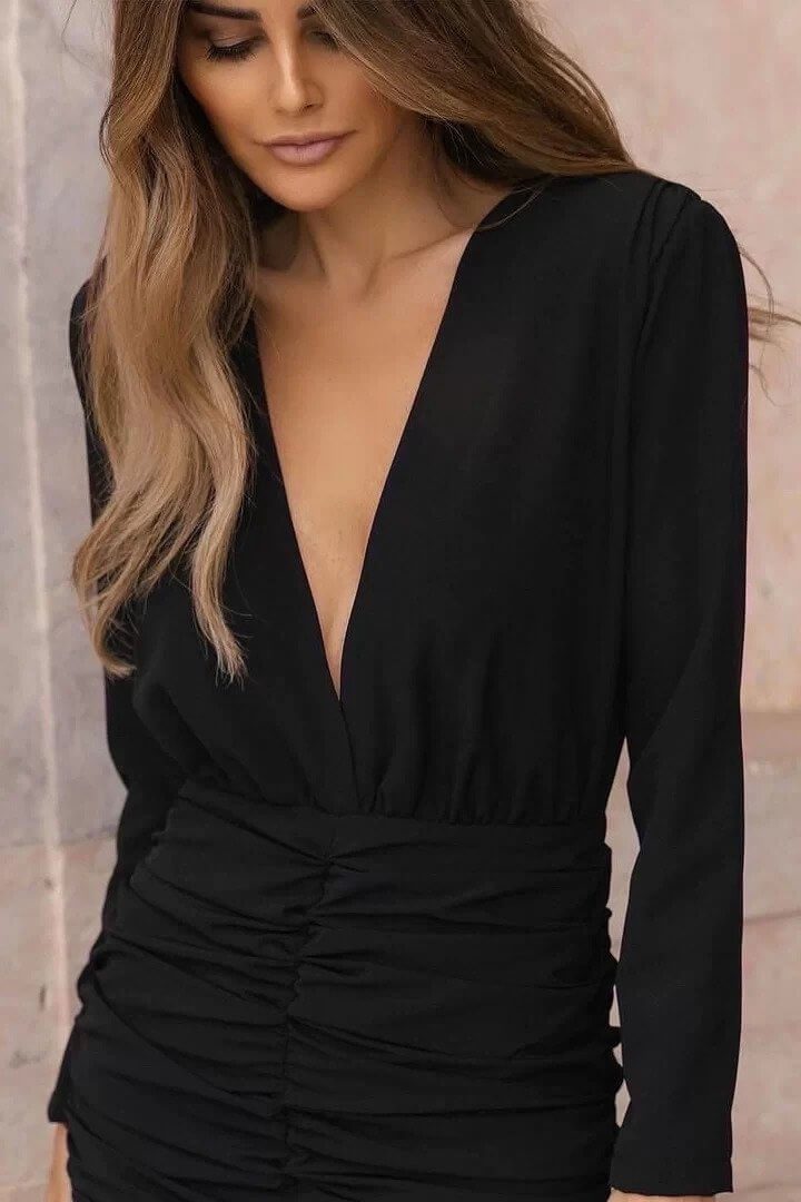 Fernanda Velez posing while wearing Black Draped Dress